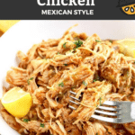 Pin Image of a white bowl filled with Mexican-style shredded chicken