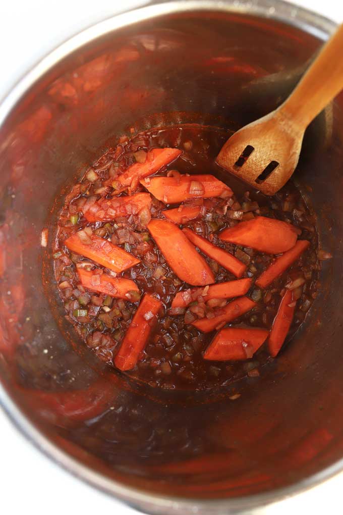 Onions, celery, carrots, tomato paste and wine in the instant pot.