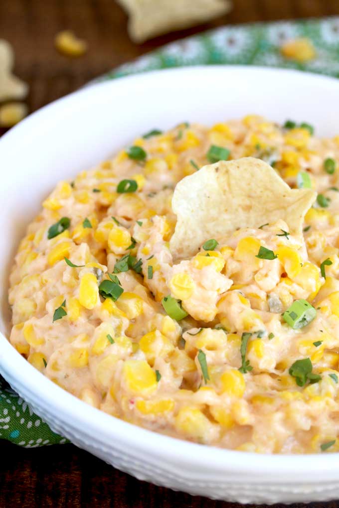 Close up view of a bowl filled with corn dip.