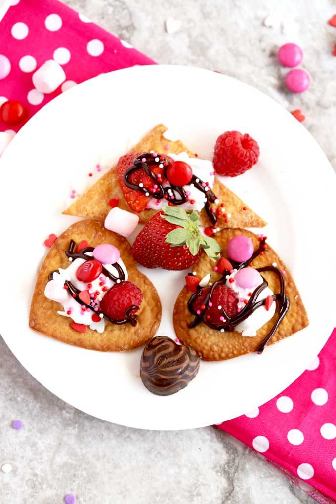 A small plate with heart shaped dessert nachos.