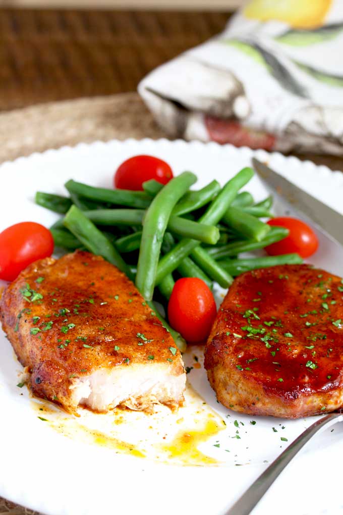 Served Pork Chops with green beans and tomatoes.