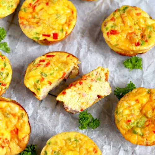 Egg muffin cut in half around other egg muffins.