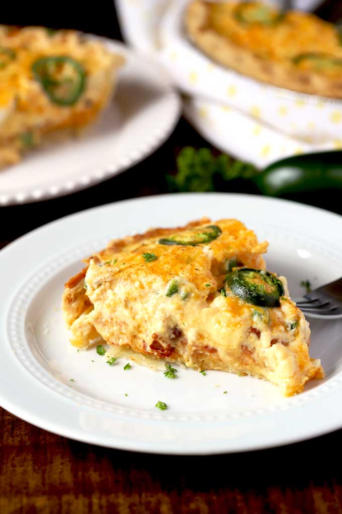 Slice of a Jalapeno Popper Quiche on a white plate