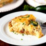 Slice of a jalapeno popper quiche on a white plate