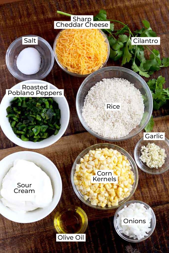 Ingredients to make this rice casserole on a wooden board.