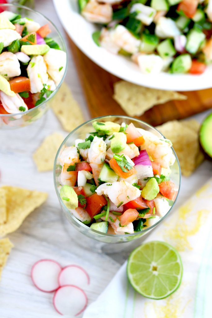 Top view of bowls filled with ceviche served with tortilla chips.