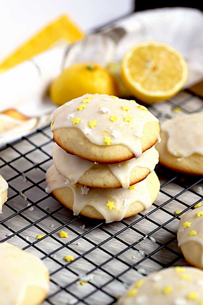 Stack of Italian lemon cookies on a cooling rack.