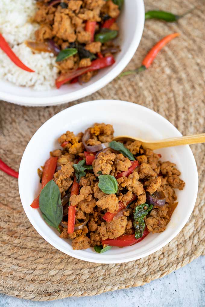 Top view of a small serving bowl filled with Thai Basil Chicken Stir Fry.