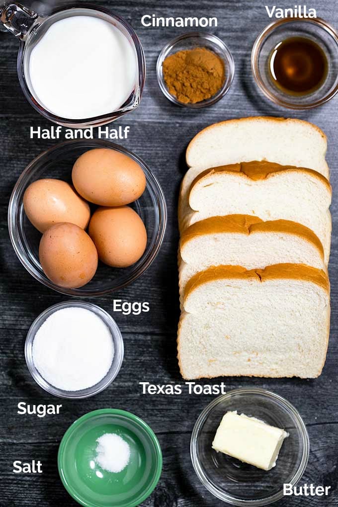 Ingredients to make French toast sticks on a dark surface.