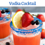 The best and easiest Strawberry Lemonade Vodka Cocktail garnished with a strawberry, blueberries and lemon slice