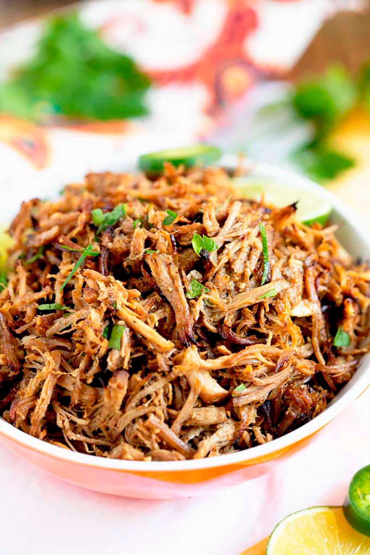 Instant Pot Carnitas pile high in a serving bowl