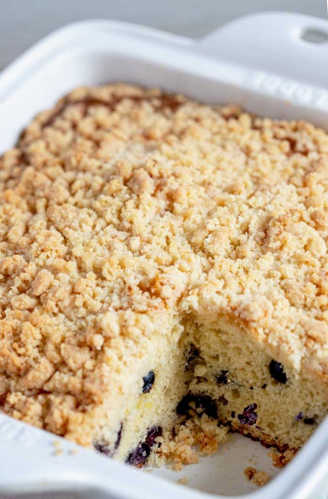 View of the crumb topping of the coffee cake inside a baking dish.