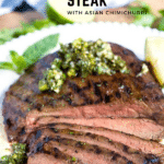 Sliced Korean Grilled Flank Steak topped with Asian Chimichurri on a white plate