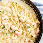 This Shrimp Alfredo recipe is packed with tender shrimp in a rich, creamy and cheesy Parmesan sauce. This restaurant quality Shrimp Alfredo Pasta is impressive, easy to make and one of our favorite seafood pasta recipes!