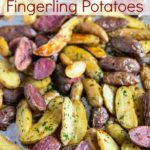 Roasted Fingerling Potatoes tossed with olive oil, garlic and rosemary are crispy on the outside and soft on the inside. These easy to make oven roasted potatoes are the perfect side dish to almost any meal!