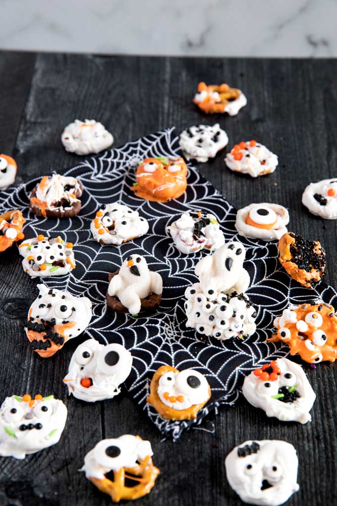 Halloween Pretzels on a dark surface.