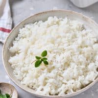 Cooked white rice in a serving bowl.
