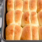 View of a baking dish filled with Parker House Rolls