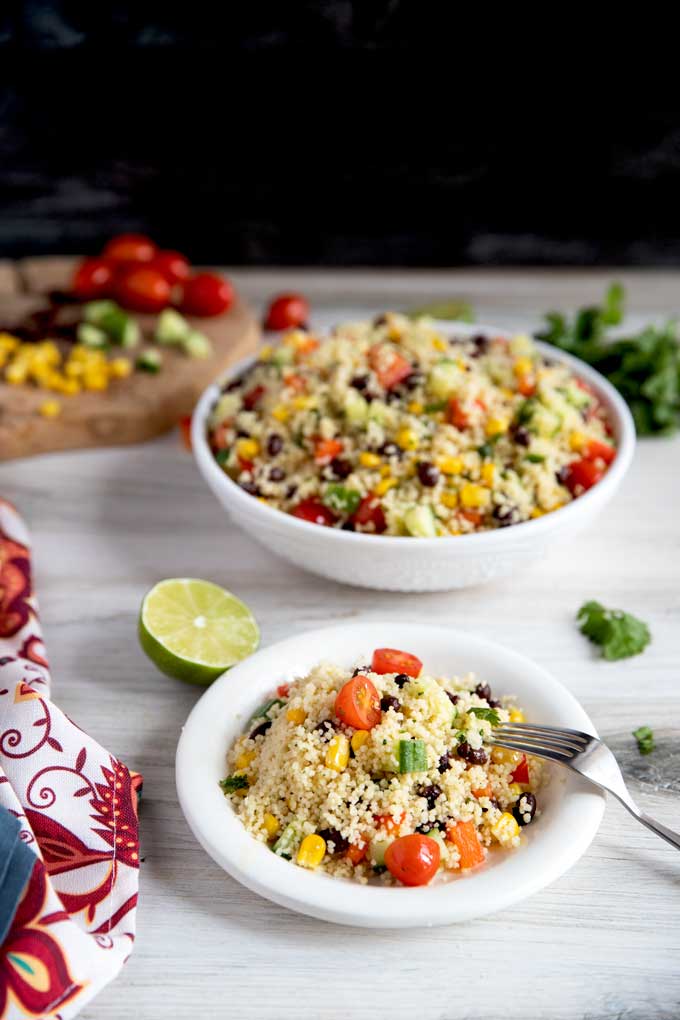 A bowl and a plate with Southwest Couscous Salad