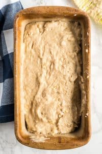 banana bread batter in a loaf pan