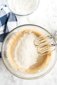 adding dry ingredients to the banana mixture