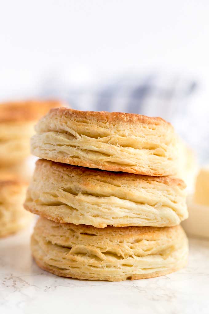 Stack of biscuits on a marble surface.