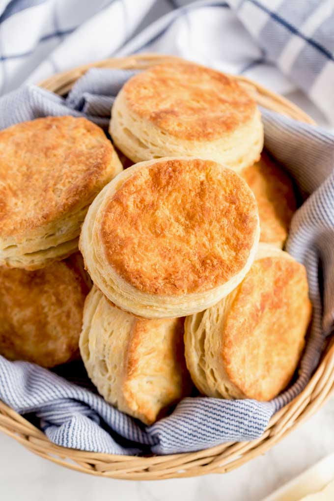 Homemade Buttermilk Biscuits on a bread basket.