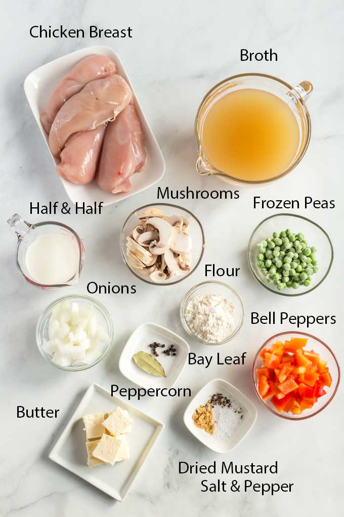 Ingredients for the chicken a la king over a marbled surface