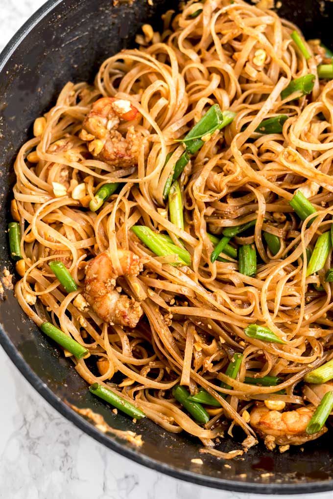 Shrimp Pad Thai in a wok.