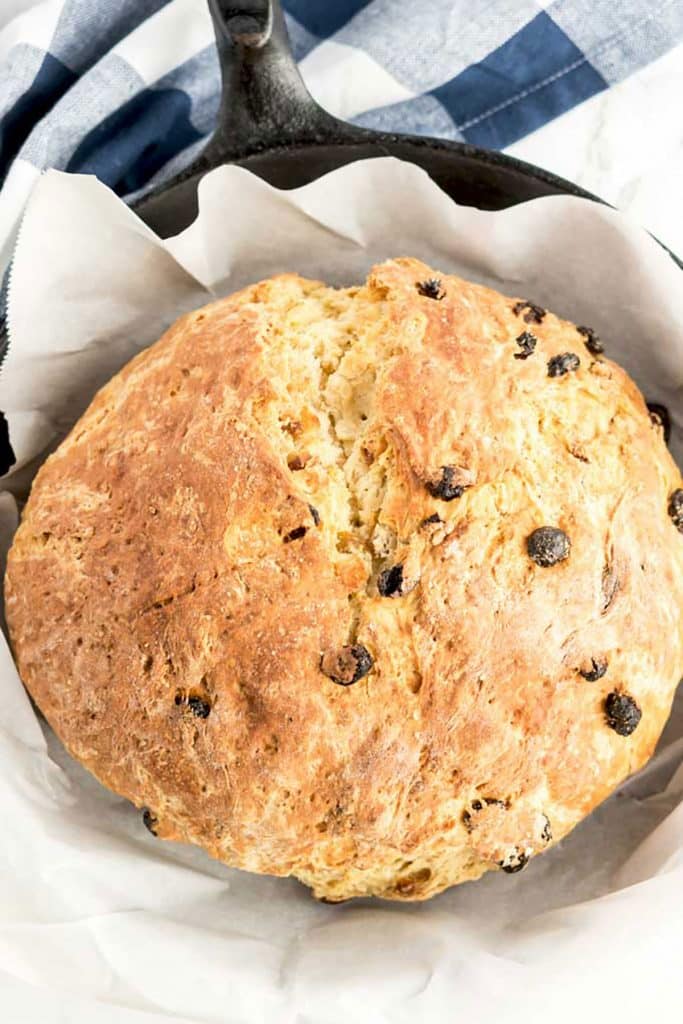 A loaf of Soda bread in a cast iron skillet.