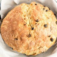 A loaf of Soda bread in a cast iron skillet.