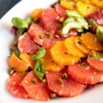 Citrus Salad with sliced grapefruit, oranges and avocado on a platter