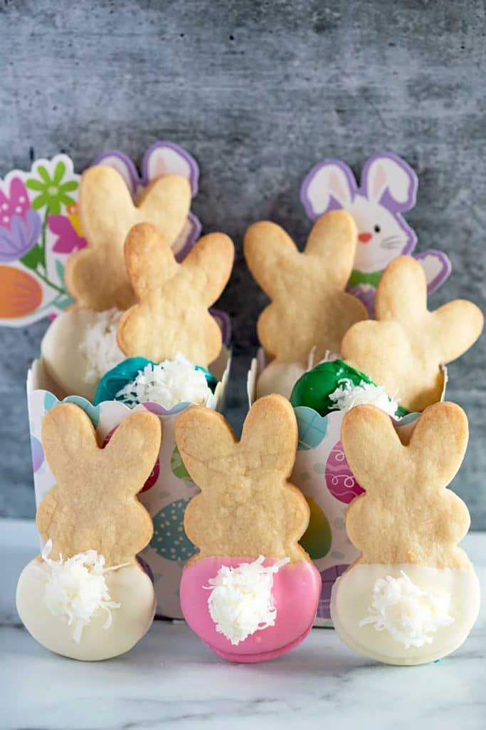 Cute and festive Easter Bunny Cookies made with shortbread cookies dipped in chocolate.