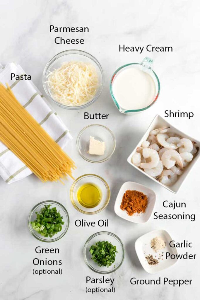 All ingredients needed to make spaghetti with shrimp and Cajun Alfredo sauce