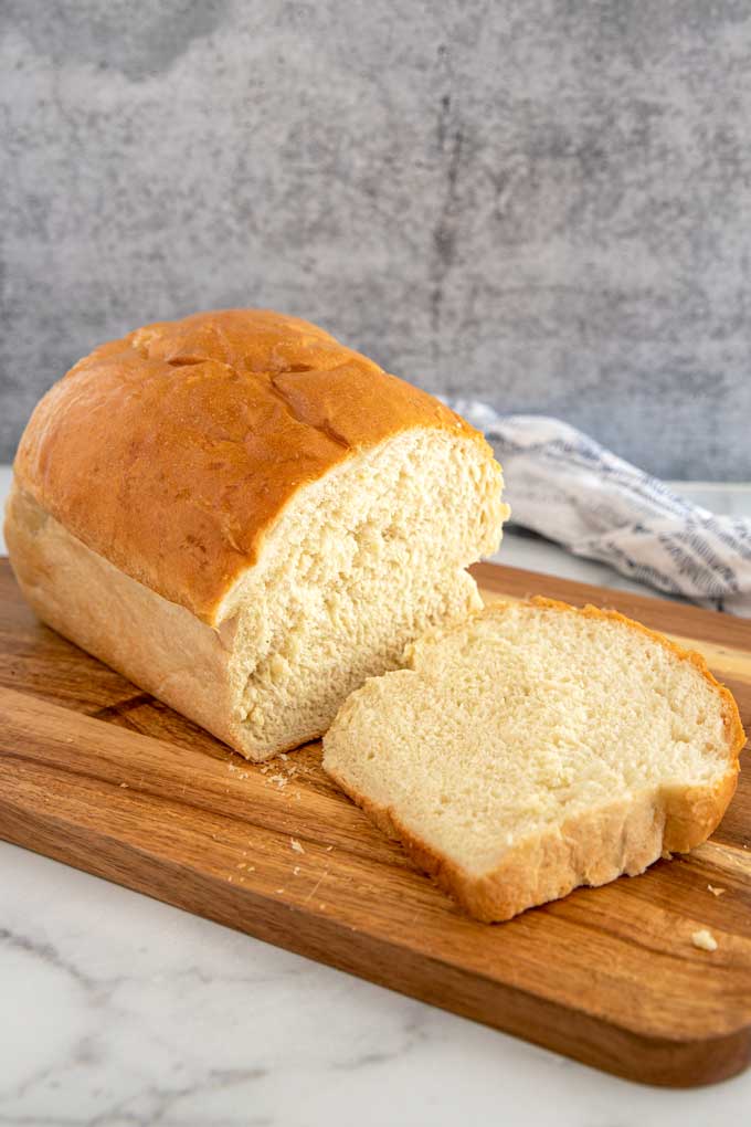 White bread sliced on a cutting board.