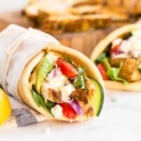 Chicken Shawarma wrap filled with vegetables and sauce.