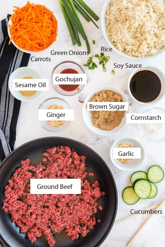 Ingredients for making Korean Beef Bowls on a light surface.