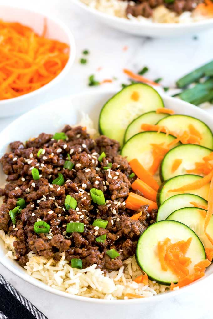 Korean Rice bowl with ground beef, carrots and cucumbers.