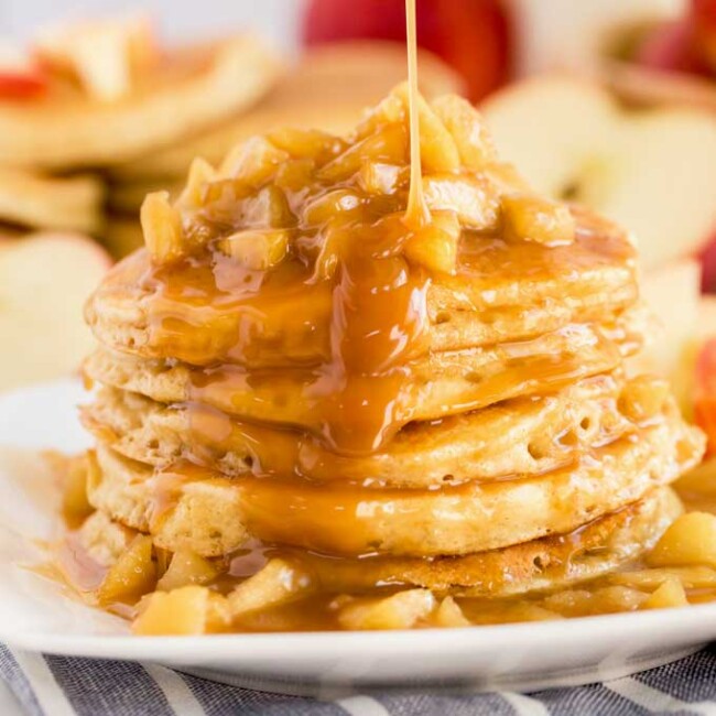 Stack of apple pancakes drizzled with caramel
