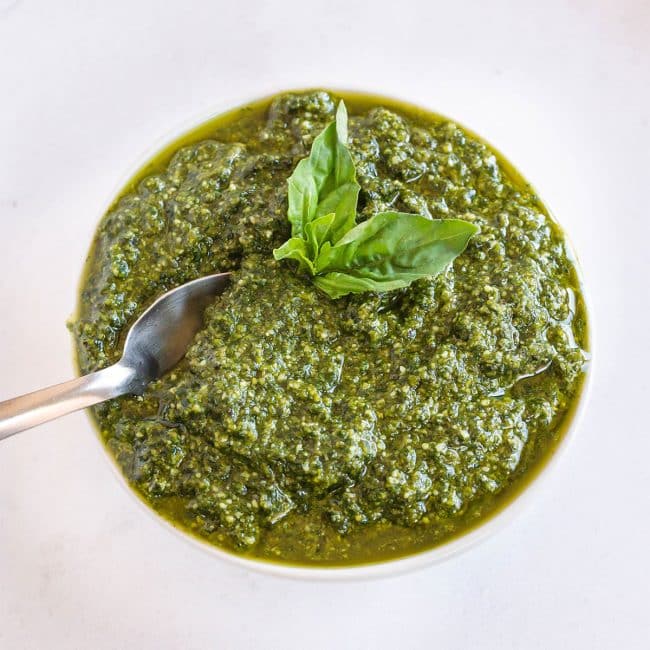 top view of pesto sauce in a white bowl