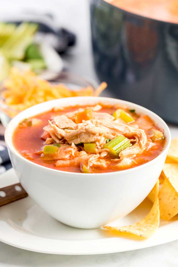A white bowl filled with homemade Tortilla soup