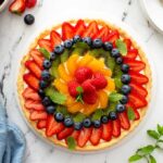 Top view of a French Tart on a white serving platter.