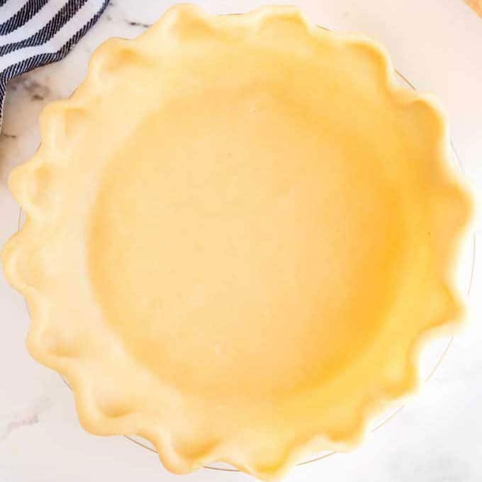 Perfect pie dough crust on a pie plate.