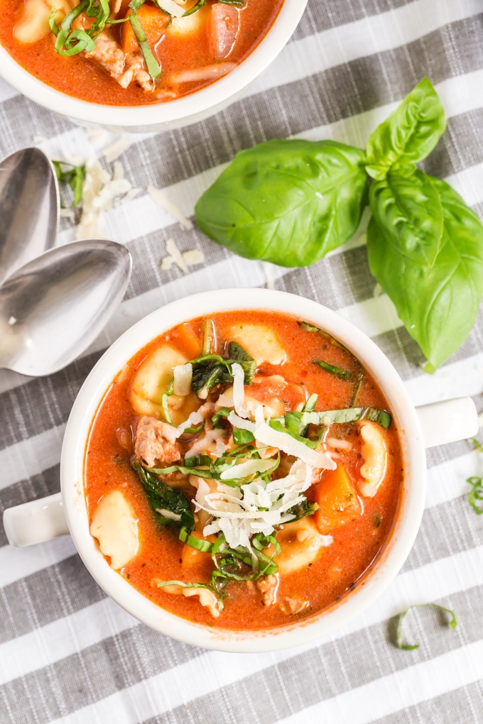 A bowl of creamy Italian soup topped with Parmesan cheese.