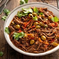 Shredded beef Ropa vieja in a white bowl.