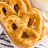 Golden soft pretzels in a white plate