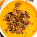 Pin image of butternut squash soup in a white bowl