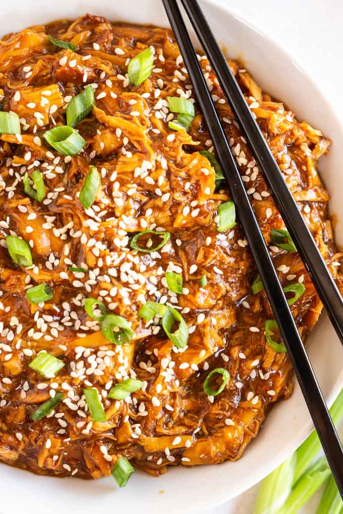 A white bowl filled with teriyaki chicken made in the instant pot.