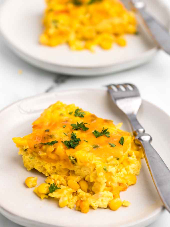 Serving of corn pudding in a white plate