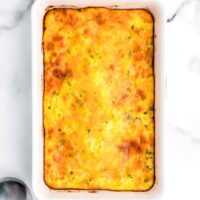Golden brown corn pudding in baking dish